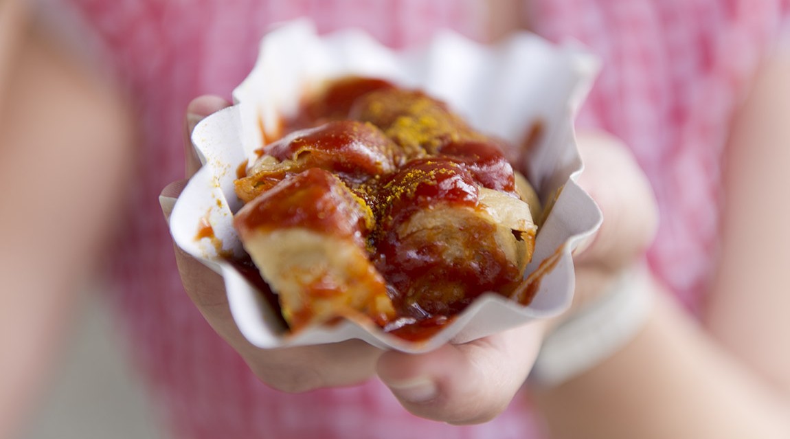 Currywurst at Konnopke’s. Photo: visitBerlin, Philip Koschel | Cornelia Brelowski Döner vs. Currywurst – On Berlin’s most beloved street foods