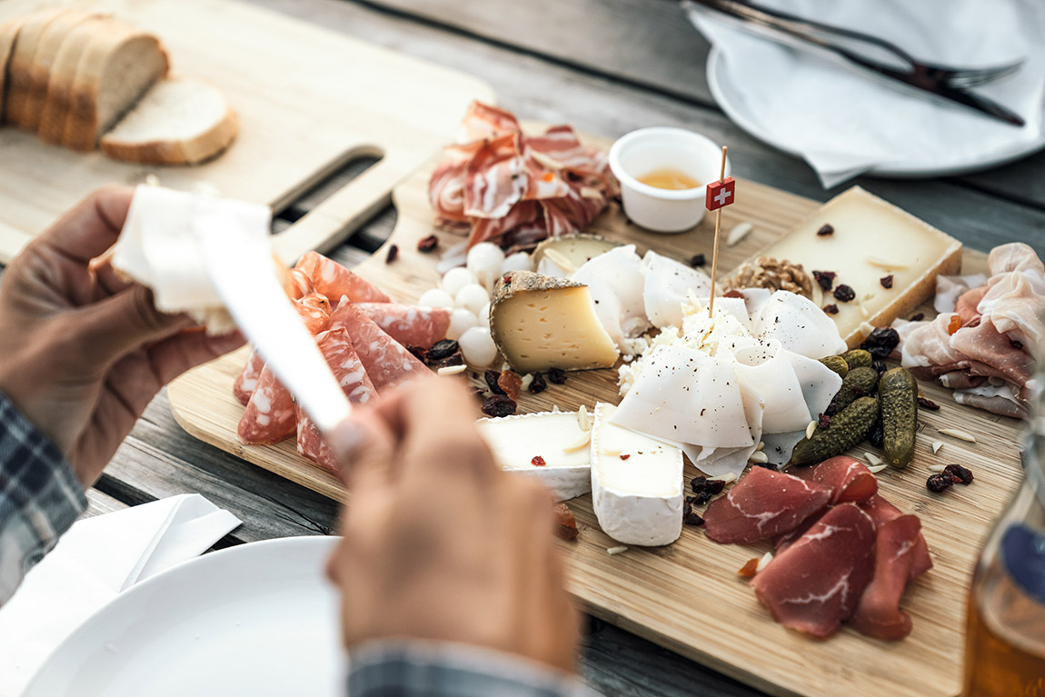 Meats and cheeses from Ticino, served at Capanna Monte Bar. Photo: Switzerland Tourism / Lorenz Richard | Ticino: The taste of tradition