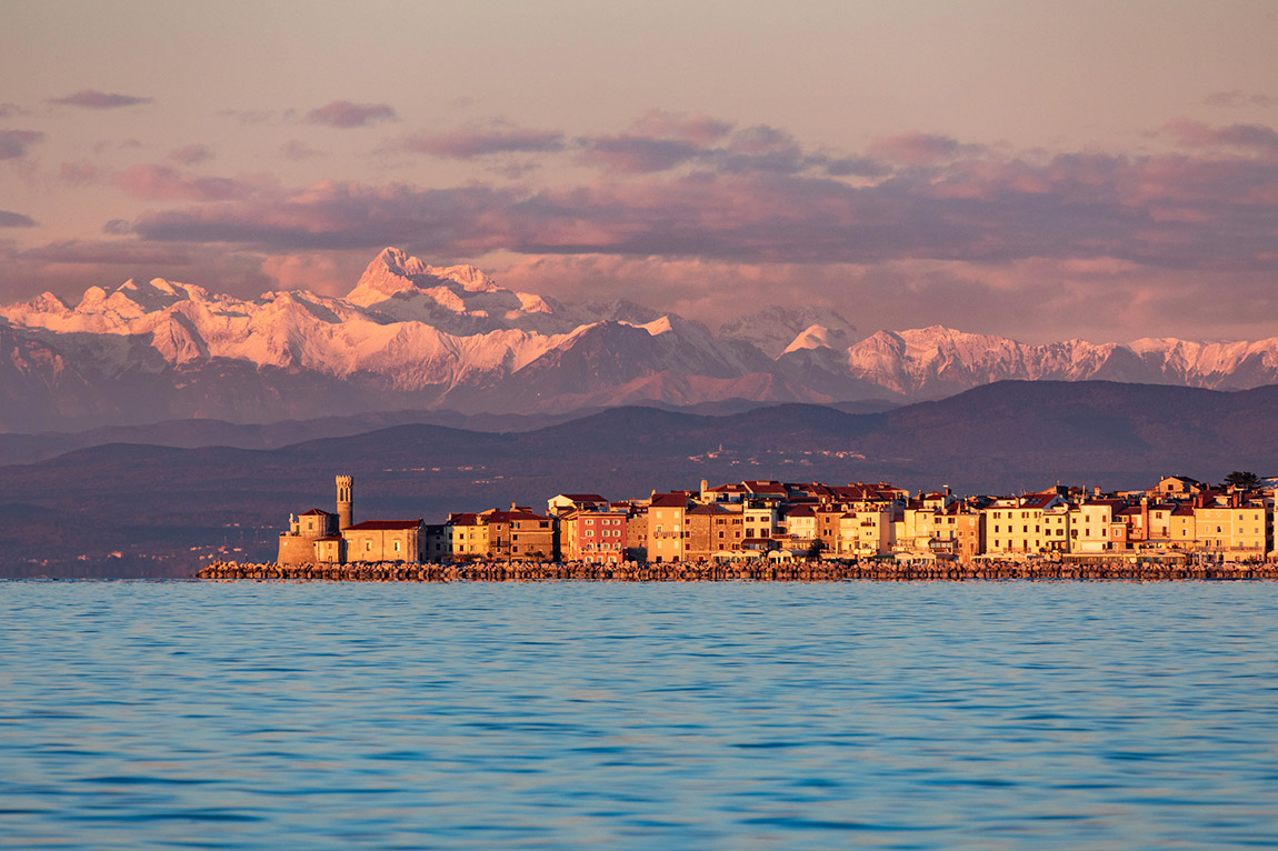 Piran with Triglav and Julian Alps. Photo: Slovenian Tourist Board/Jošt Gantar | Slovenia: Where Europe's diversity finds a home in the smallest of spaces